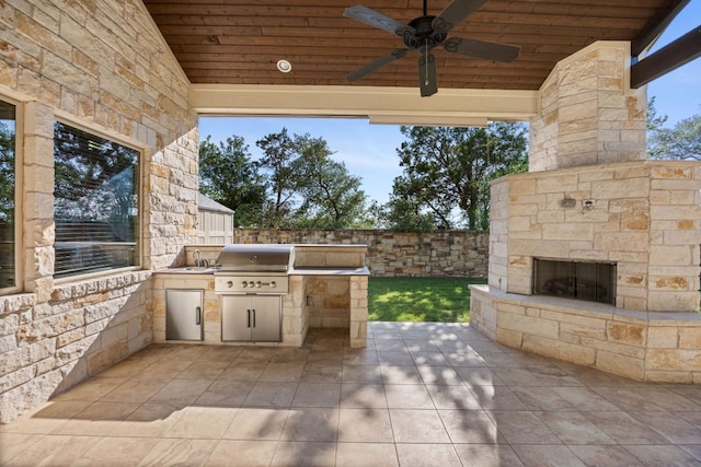 2761 Fishing Hole Cv, Leander, TX 78641 - view of patio / terrace featuring an outdoor stone fireplace, an outdoor kitchen, and ceiling fan