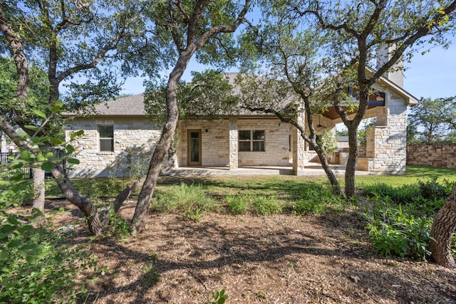 2761 Fishing Hole Cv, Leander, TX 78641 - rear view of property with stone siding and a patio
