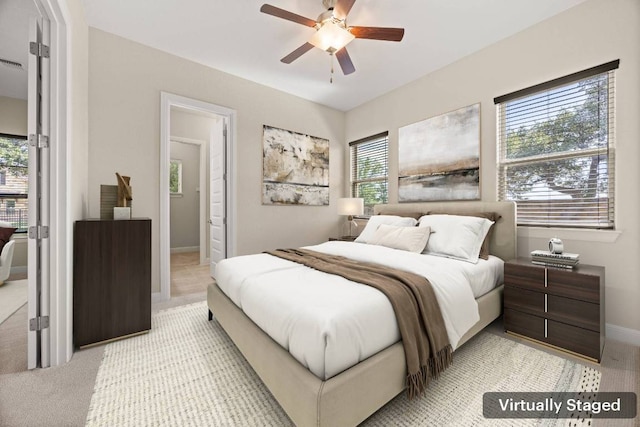 2761 Fishing Hole Cv, Leander, TX 78641 - bedroom featuring a ceiling fan and light carpet