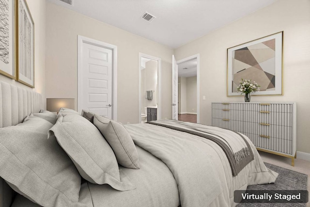 2761 Fishing Hole Cv, Leander, TX 78641 - carpeted bedroom with baseboards and ensuite bathroom