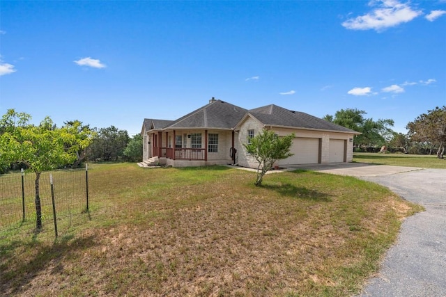 920 Barton Creek Dr, Dripping Springs, TX 78620 - ranch-style house featuring covered porch, an attached garage, and asphalt driveway