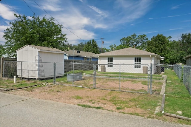 1727 Leander St, Georgetown, TX 78626 - view of front of home featuring a gate, fence, an outbuilding, and a storage unit