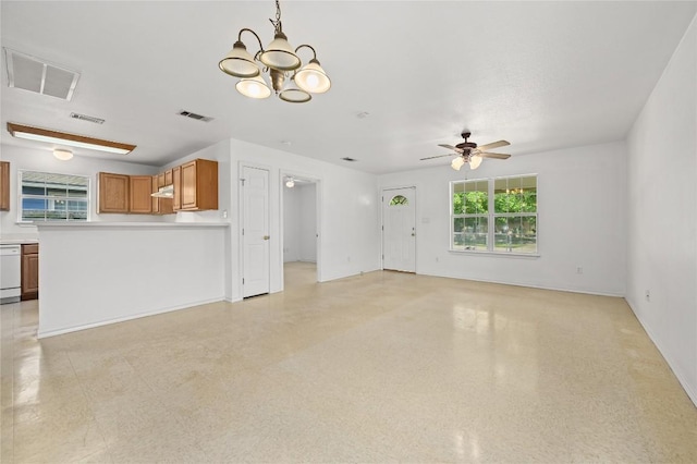 1727 Leander St, Georgetown, TX 78626 - unfurnished living room featuring ceiling fan, a chandelier, and baseboards