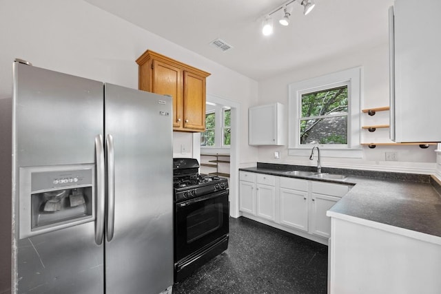 713 Patterson Ave, Austin, TX 78703 - kitchen with stainless steel fridge with ice dispenser, a sink, black gas range oven, dark countertops, and white cabinets