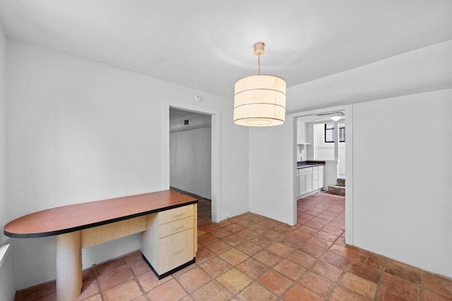 713 Patterson Ave, Austin, TX 78703 - unfurnished dining area featuring light stone finish floors and a ceiling fan