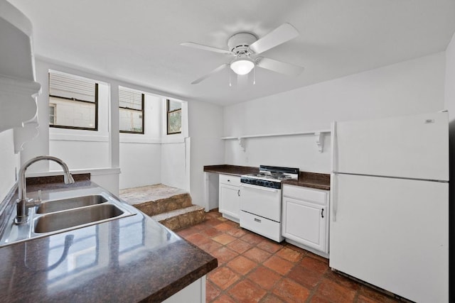 713 Patterson Ave, Austin, TX 78703 - kitchen with white appliances, open shelves, dark countertops, ceiling fan, and white cabinetry