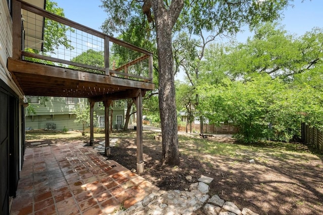 713 Patterson Ave, Austin, TX 78703 - fenced backyard featuring a patio area and a wooden deck