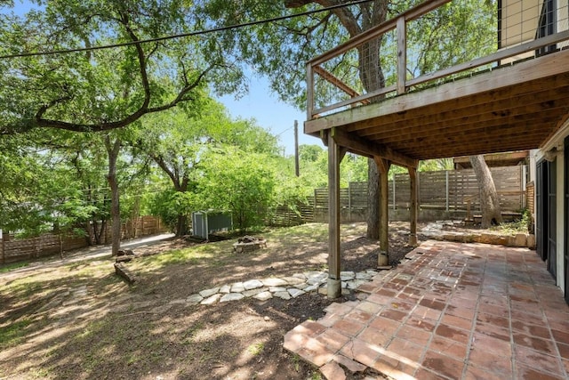 713 Patterson Ave, Austin, TX 78703 - fenced backyard with an outdoor fire pit, a patio, and a deck