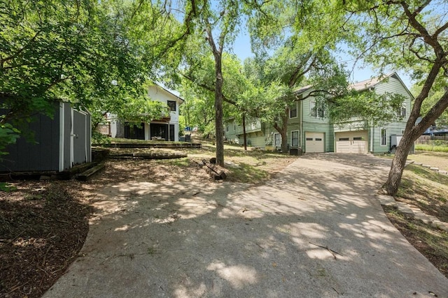 713 Patterson Ave, Austin, TX 78703 - view of front of house with concrete driveway and a garage