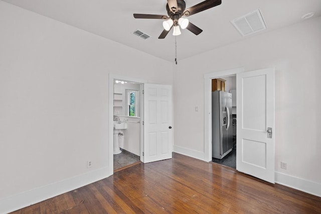 713 Patterson Ave, Austin, TX 78703 - unfurnished bedroom with stainless steel refrigerator with ice dispenser, wood finished floors, ensuite bathroom, a walk in closet, and ceiling fan