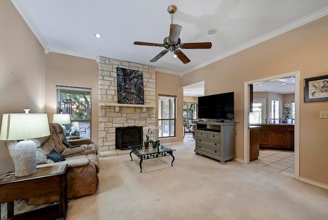 217 Fox Xing, Burnet, TX 78611 - living room with crown molding, light colored carpet, a stone fireplace, ceiling fan, and baseboards