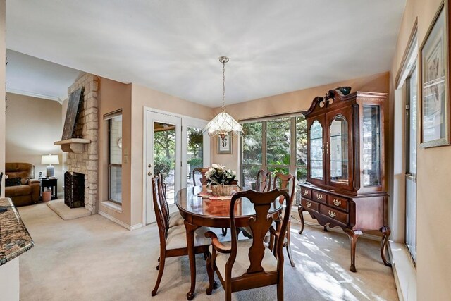 217 Fox Xing, Burnet, TX 78611 - dining space featuring light carpet and a fireplace