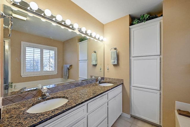 217 Fox Xing, Burnet, TX 78611 - full bath featuring double vanity, tile patterned flooring, and a bathtub