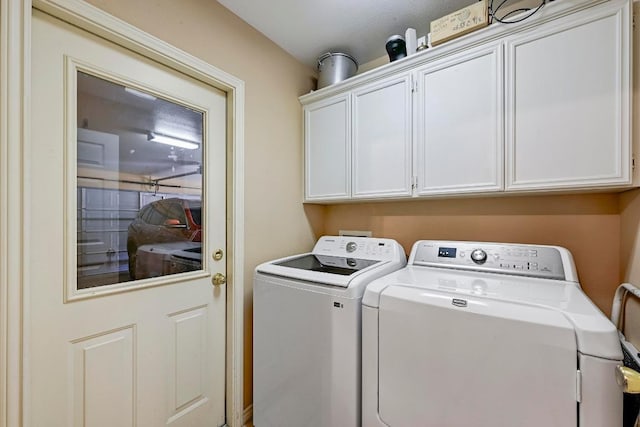 217 Fox Xing, Burnet, TX 78611 - washroom featuring washing machine and clothes dryer and cabinet space