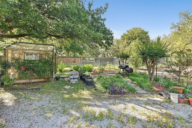 217 Fox Xing, Burnet, TX 78611 - view of yard featuring fence, a storage shed, and an outdoor structure
