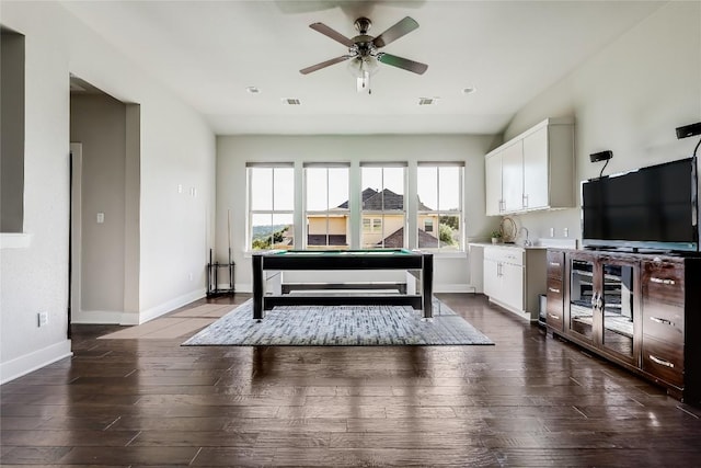 living area with baseboards, ceiling fan, dark wood finished floors, and pool table