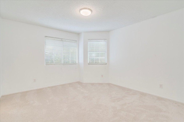 10902 Wareham Ct, Austin, TX 78739 - unfurnished room with carpet and a textured ceiling