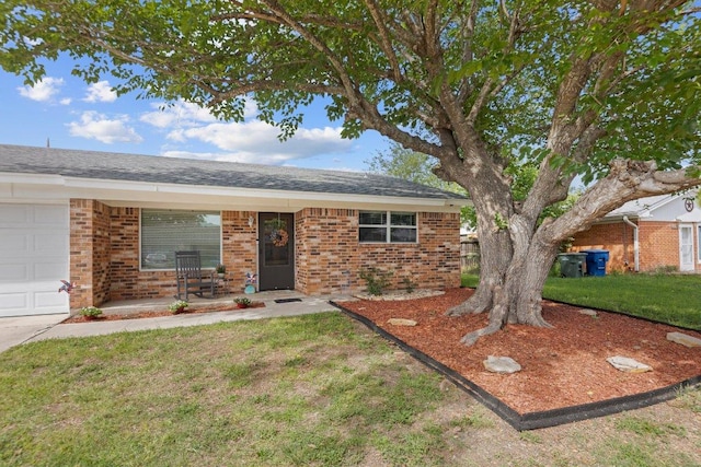 1611 Velma Ave, Copperas Cove, TX 76522 - ranch-style house featuring brick siding, covered porch, a garage, and a front yard