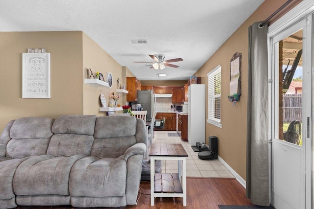 1611 Velma Ave, Copperas Cove, TX 76522 - living area featuring ceiling fan, light wood-style flooring, and baseboards