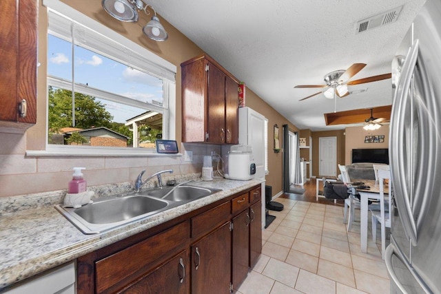 1611 Velma Ave, Copperas Cove, TX 76522 - kitchen with freestanding refrigerator, a ceiling fan, light countertops, a sink, and light tile patterned floors