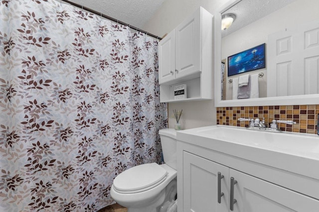 1611 Velma Ave, Copperas Cove, TX 76522 - full bath with a textured ceiling, backsplash, toilet, and vanity