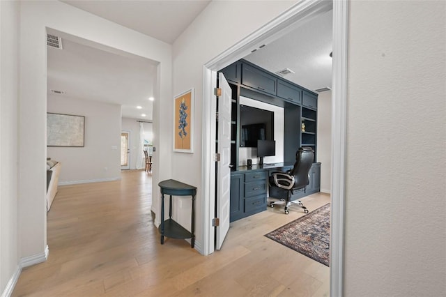 8716 Mina Dr, Austin, TX 78747 - hallway featuring light wood finished floors, a desk, and recessed lighting