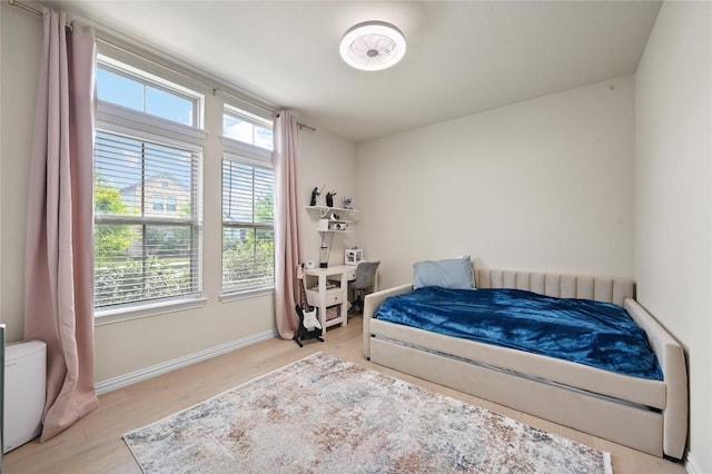 8716 Mina Dr, Austin, TX 78747 - bedroom with light wood-style floors and baseboards