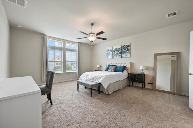 8716 Mina Dr, Austin, TX 78747 - bedroom with light carpet, baseboards, and a ceiling fan
