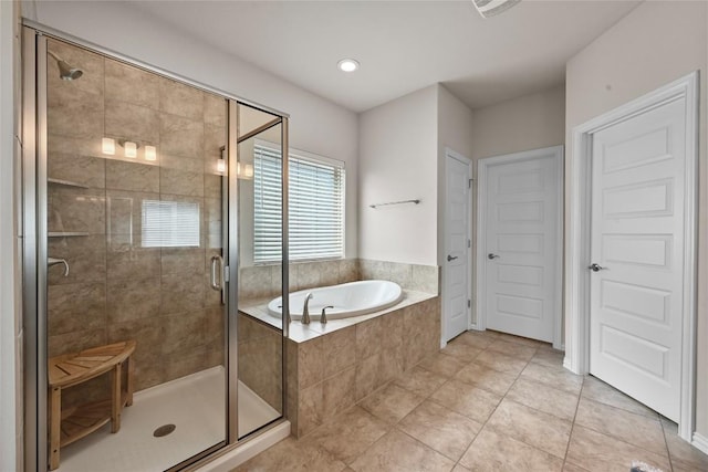 8716 Mina Dr, Austin, TX 78747 - bathroom with a garden tub, a stall shower, tile patterned flooring, and recessed lighting