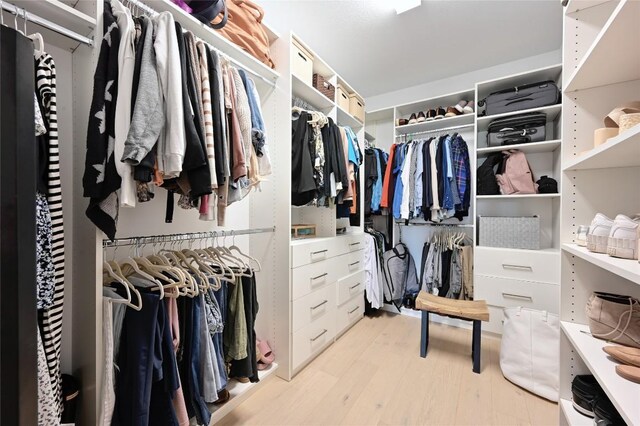 8716 Mina Dr, Austin, TX 78747 - spacious closet with light wood finished floors
