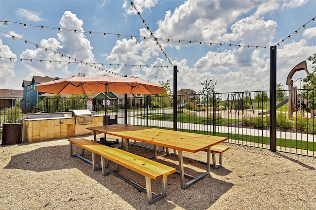 8716 Mina Dr, Austin, TX 78747 - surrounding community with an outdoor kitchen