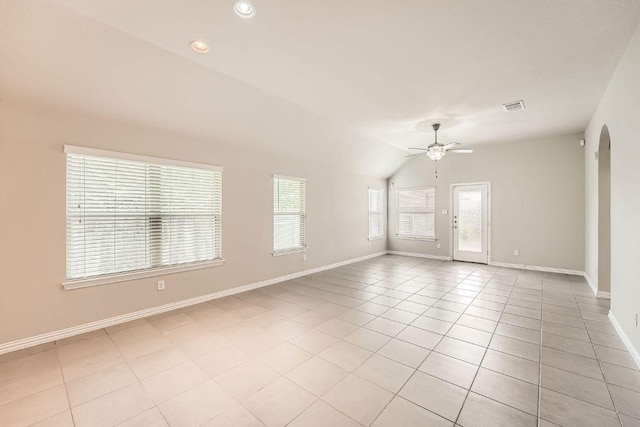 spare room with a ceiling fan, baseboards, light tile patterned flooring, lofted ceiling, and recessed lighting