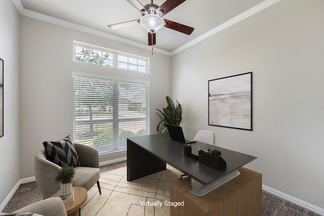 office with baseboards, a ceiling fan, crown molding, and light carpet