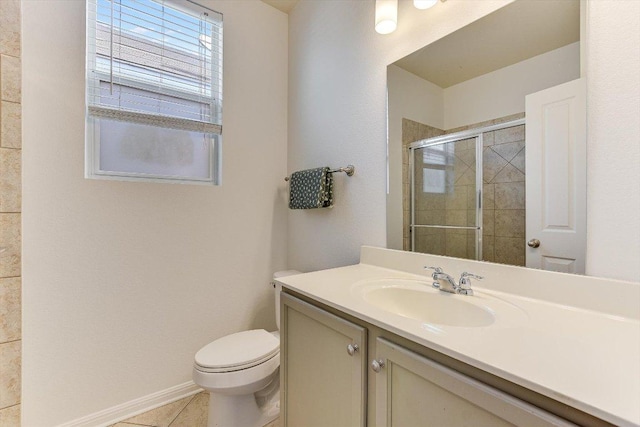 175 Grace St, Kyle, TX 78640 - full bath featuring a shower stall, toilet, vanity, tile patterned flooring, and baseboards