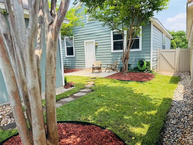 175 Grace St, Kyle, TX 78640 - rear view of property featuring a patio area and a gate