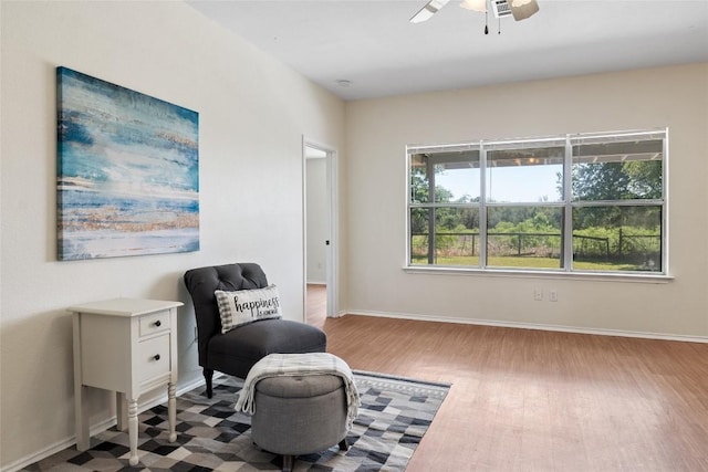 140 Shenandoah Trl, Elgin, TX 78621 - living area with wood finished floors, a ceiling fan, and baseboards