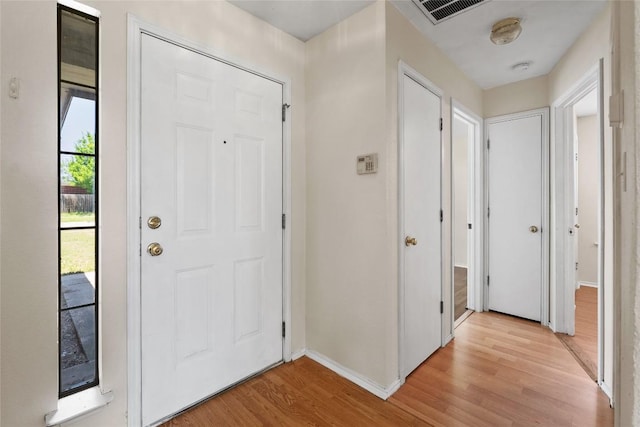 140 Shenandoah Trl, Elgin, TX 78621 - foyer with light wood-style floors and baseboards
