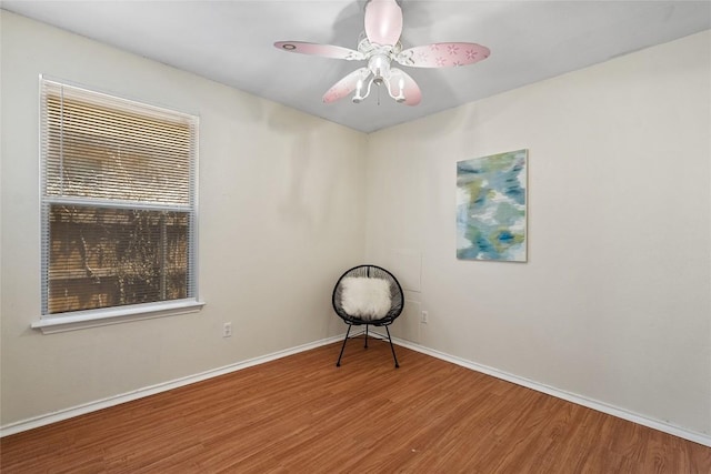 140 Shenandoah Trl, Elgin, TX 78621 - spare room featuring wood finished floors, baseboards, and a ceiling fan