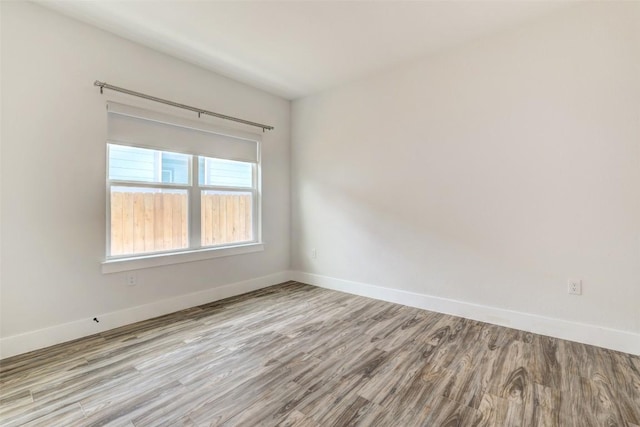 9601 Eloquence Dr, Manor, TX 78653 - empty room featuring wood finished floors and baseboards