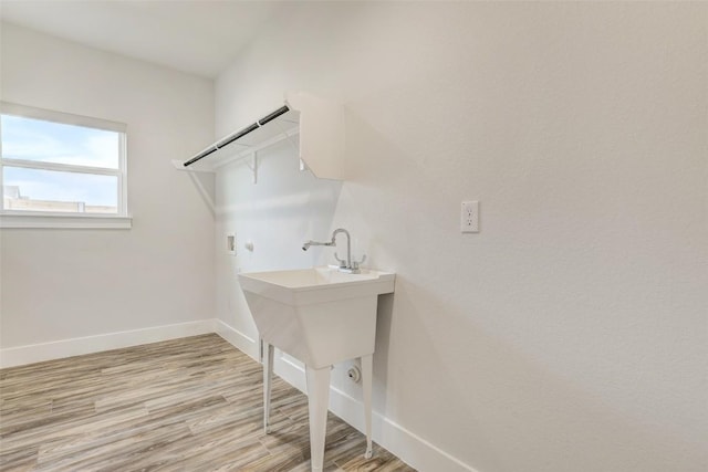 9601 Eloquence Dr, Manor, TX 78653 - washroom featuring hookup for a washing machine and light wood-type flooring