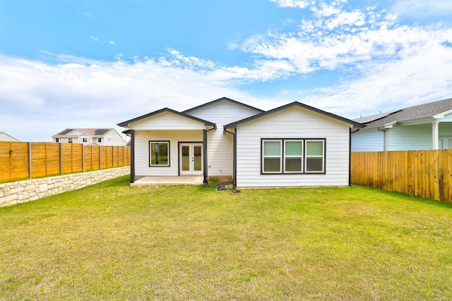 9601 Eloquence Dr, Manor, TX 78653 - back of house with a fenced backyard, french doors, and a patio