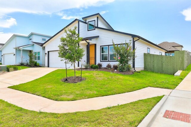 9601 Eloquence Dr, Manor, TX 78653 - view of front of house featuring an attached garage and driveway