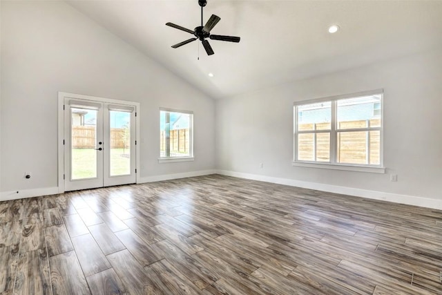 9601 Eloquence Dr, Manor, TX 78653 - empty room with healthy amount of natural light, wood finished floors, ceiling fan, high vaulted ceiling, and recessed lighting