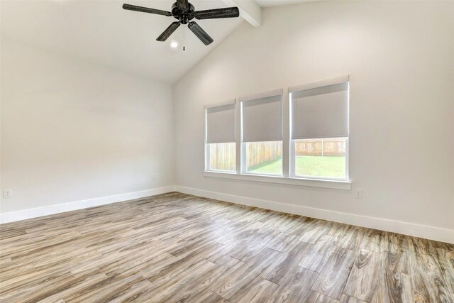 9601 Eloquence Dr, Manor, TX 78653 - spare room with wood finished floors, beamed ceiling, ceiling fan, and high vaulted ceiling