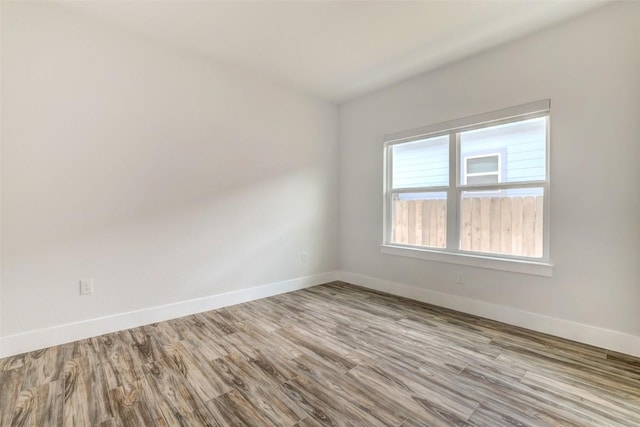 9601 Eloquence Dr, Manor, TX 78653 - empty room with baseboards and wood finished floors