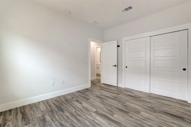 9601 Eloquence Dr, Manor, TX 78653 - unfurnished bedroom featuring wood finished floors and a closet
