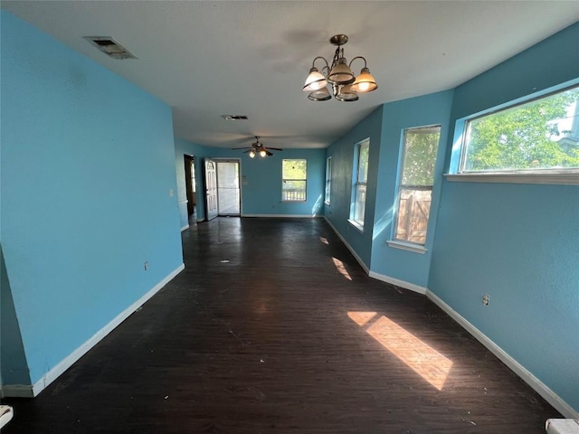 7205 Bethune Ave, Austin, TX 78752 - empty room with baseboards, dark wood-style flooring, and plenty of natural light
