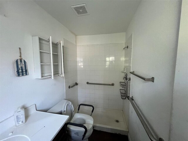 7205 Bethune Ave, Austin, TX 78752 - full bath featuring toilet, a shower stall, and vanity