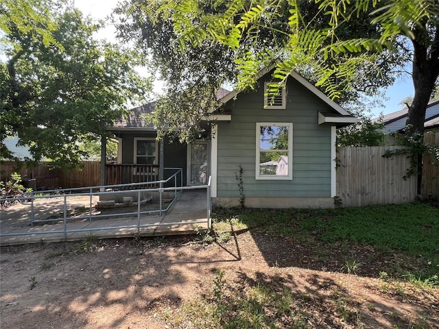 7205 Bethune Ave, Austin, TX 78752 - bungalow-style home featuring fence and a wooden deck