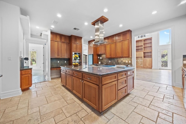 106 Sendera Bonita, Austin, TX 78734 - kitchen featuring stone tile flooring, island range hood, backsplash, oven, and recessed lighting
